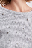 Round neck tricot knit jumper with stone stitchery low cut decolette at back